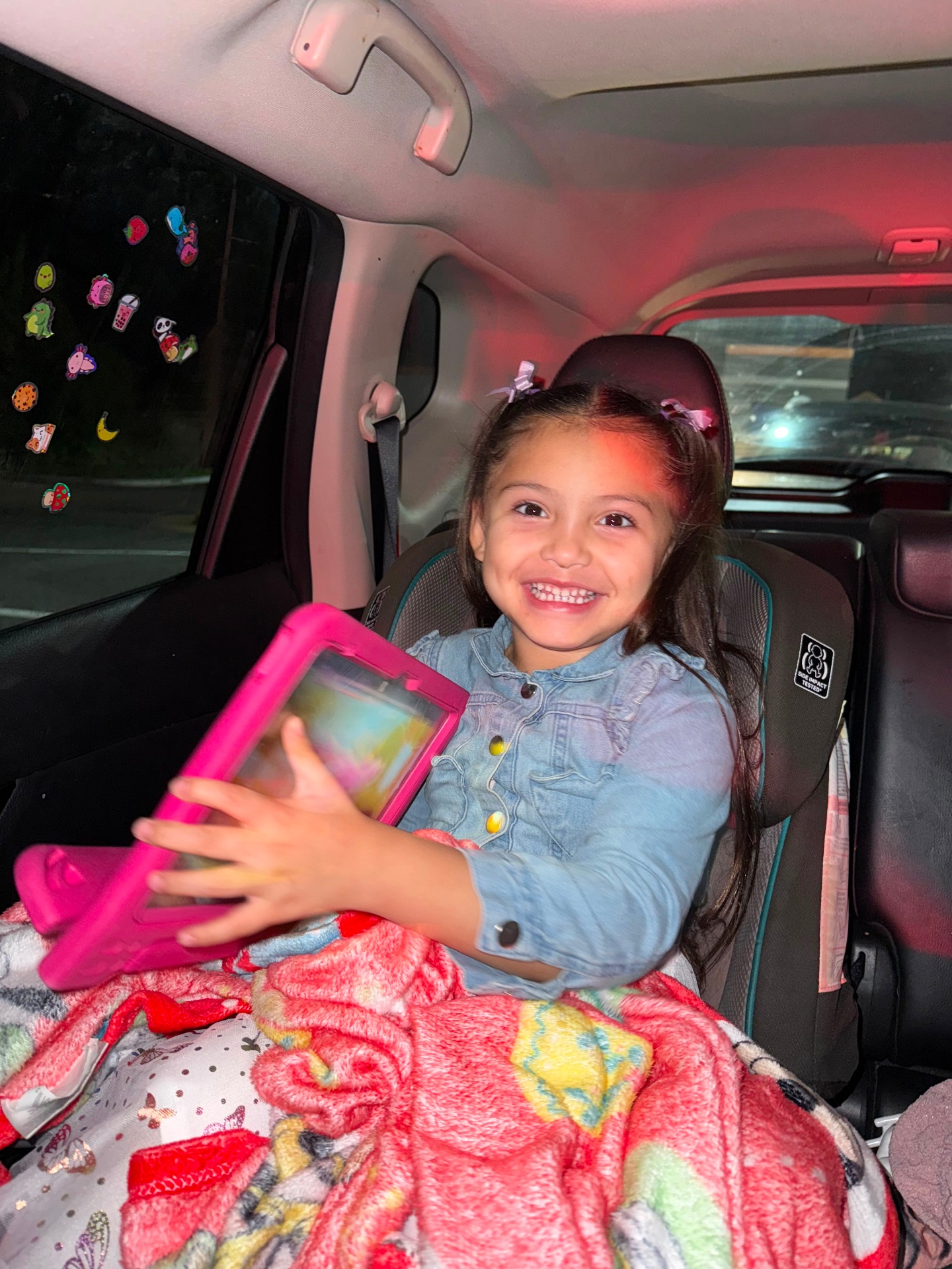 Little one of the City Star family smiling in her car seat